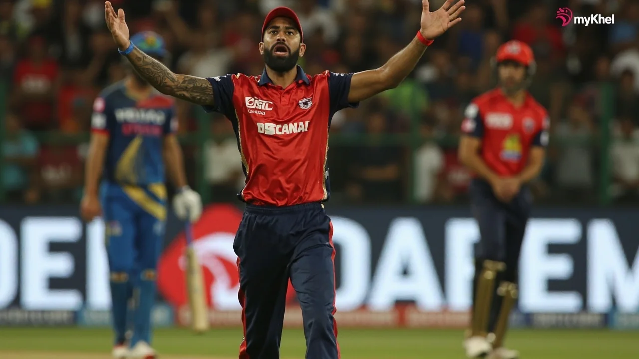 T20 fielders set in a tight catching ring on the off side during a middle-overs spell with cones and equipment near the boundary
